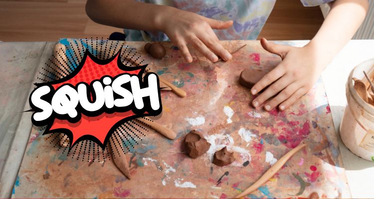 A light-skinned child's hands roll a small sliver of brown clay on a worktop that it covered in paint and clay stains; dynamic text reading "SQUISH" is next to the action.