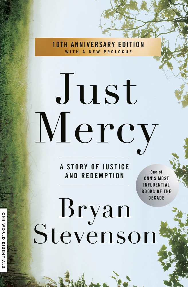 Grass climbs up the side of the image and leaves reach down on the opposing side for the cover of Just Mercy.
