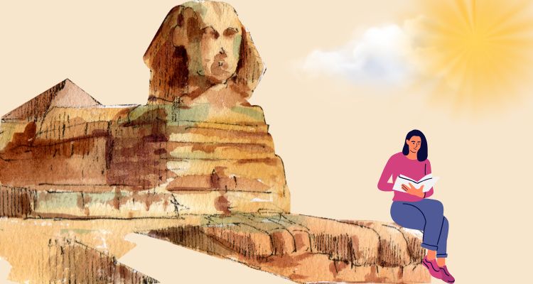 A woman reading a book while sitting on iconic momuments in Egypt.