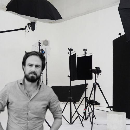 Director Justin Kurzel stands in front of a film set.