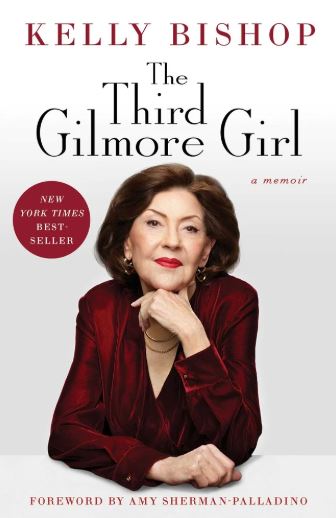 An older woman, well dressed, smiles while looking ahead on the cover of The Third Gilmore Girl.