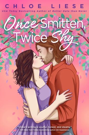 A man and woman embrace in a kiss with flowers blooming above them on the cover of Once Smitten, Twice Shy.