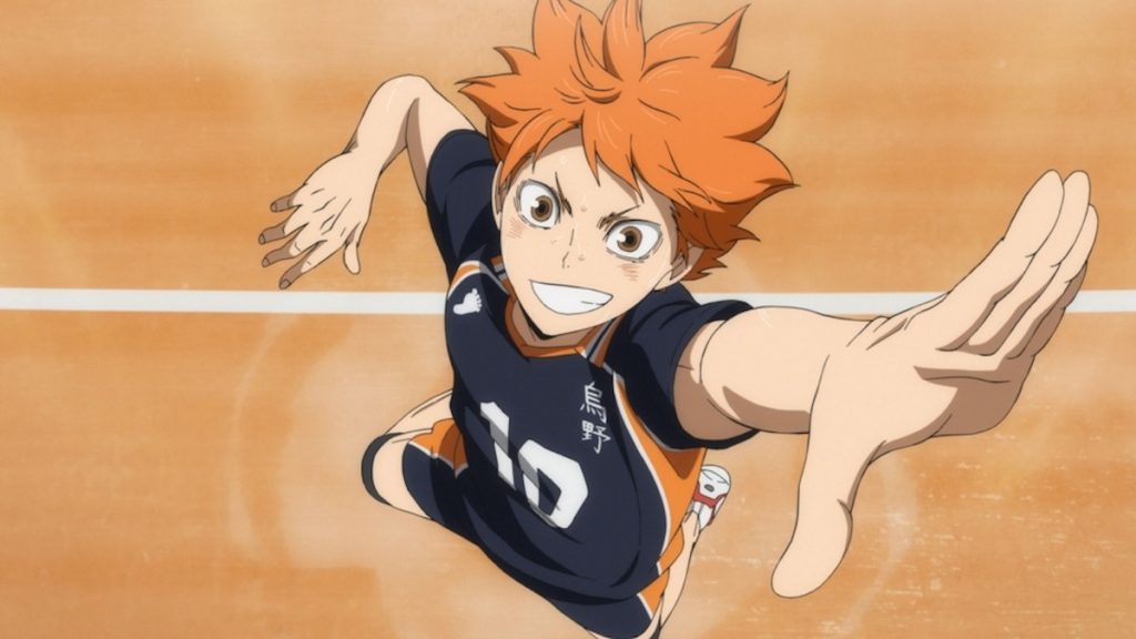 Hinata grinning while in the air positioning to spike a volleyball