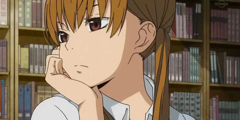 Mizutani Shizuku sitting in the library looking to the side with her chin resting in her palm