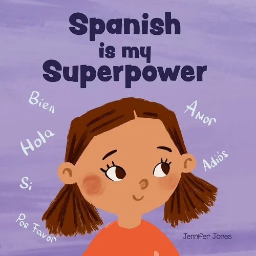 Spanish is my Superpower by Jennifer Jones. The cover is purple with a young animated girl and Spanish words floating in the air around her such as "hola," "amor," "adios," and "por favor."