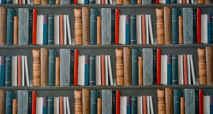 Three bookshelves with generic books.