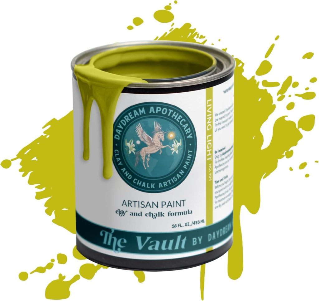 A splatter of paint behind a paint can.