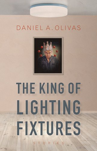 A portrait of a man hangs on a gray wall for the king of lighting fixtures by Daniel Olivas.