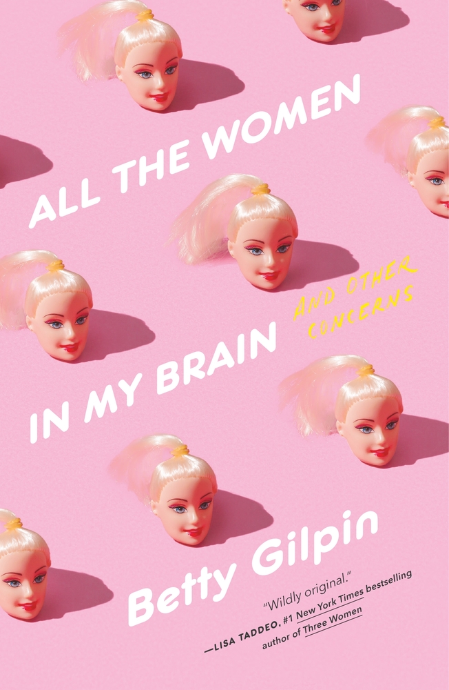 A series of Barbie heads sit on a pink table for All the Women in My Brain