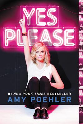 Amy Poehler holds up a piece sign in front of the neon lights of the title: Yes, Please