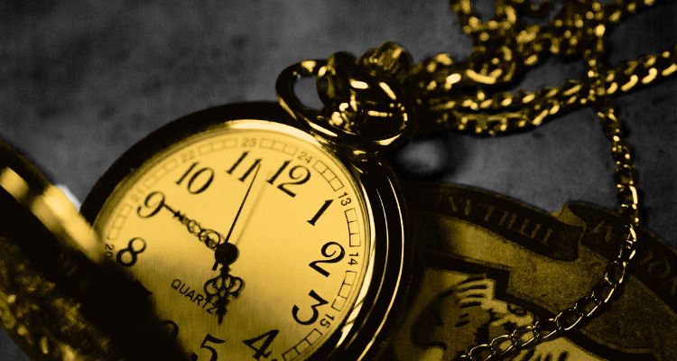 A vintage golden pocket watch with intricate chain details, highlighting the timeless value of self-care and personal freedom on Valentine’s Day.