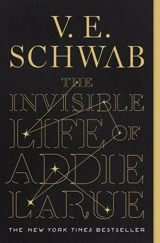 The Invisible Life of Addie Larue by V.E Schwab. Thin yellow text on a black background, with yellow constellations