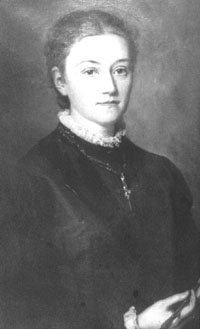 Agnes Pockels with a pen in her hand and looking straight ahead.
