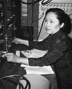Chien-Shiung Wu works at a large technological machine.