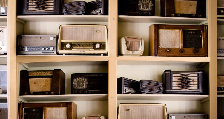 Shelves with an assortment of different radios