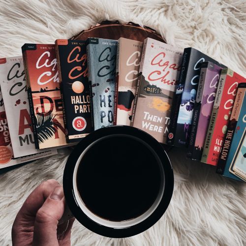 Hannah's 11 Agatha Christie book recs laid out near a cup of coffee