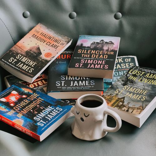 Hannah's 7 Simone St. James book recs in a neat pile.