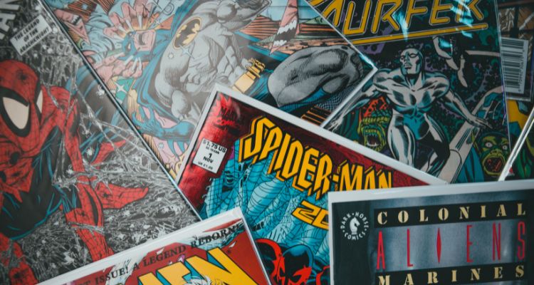 Multiple comic book covers. They are spread out. Titles include Spiderman, Batman, Silver Surfer, and X-Men.