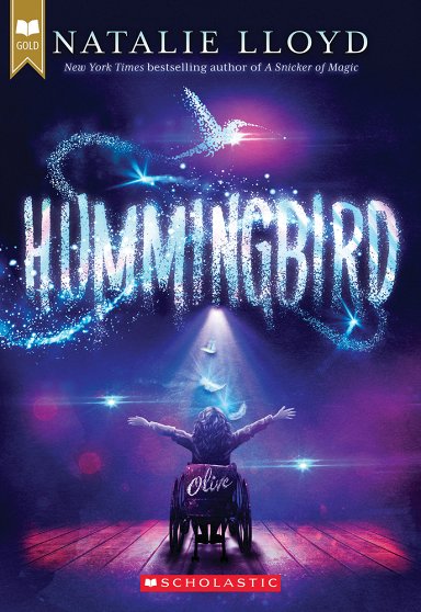 Hummingbird by Natalie Lloyd book cover showing a girl in a wheelchair with her arms thrown out and a hummingbird sparkling above her.