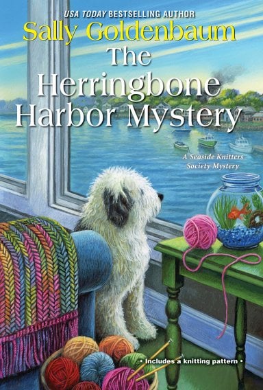 Book cover for The Herringbone Harbor Mystery by Sally Goldenbaum, featuring a dog gazing out a seaside window with knitting supplies in the foreground