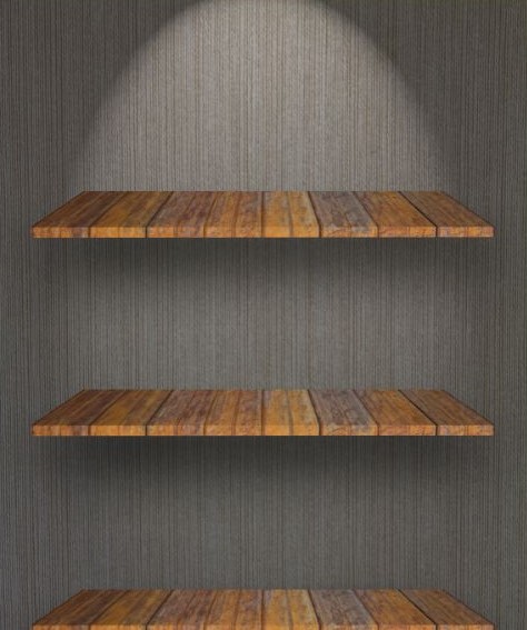 Dark wooden floating bookshelves on a dark gray wall.