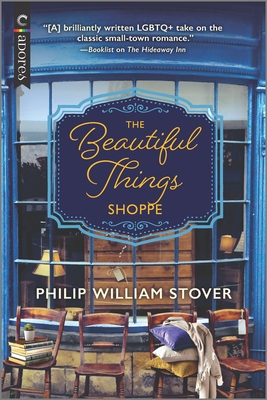 A photo of the cover of The Beautiful Things Shoppe by Philip William Stover. It's a photo of a window looking into a antique store with old chairs in front.