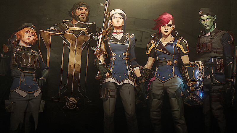 Vi, Loris, Maddie, and Steb stand in blue and gold uniforms in an industrial setting, led by a fierce Caitlyn with a rifle, exuding strength and determination.