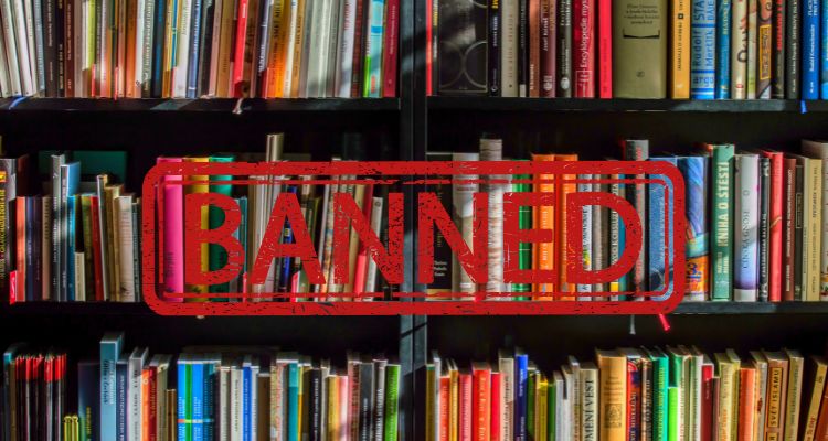 Several shelves filled with books with the word "Banned" stamped in red over everything.