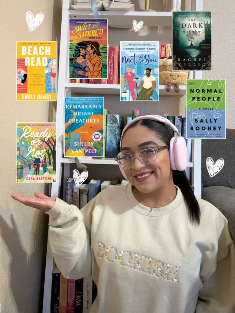 A picture of Joceline wearing headphones and smiling, her hand is up toward numerous pictures of books displayed on the picture, and hearts decorated around it. Her background is her bookshelf.
