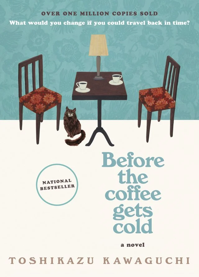 Before the Coffee Gets Cold book cover with a two chairs, a table with a lamp and two coffee cups, and a cat sitting on the floor.