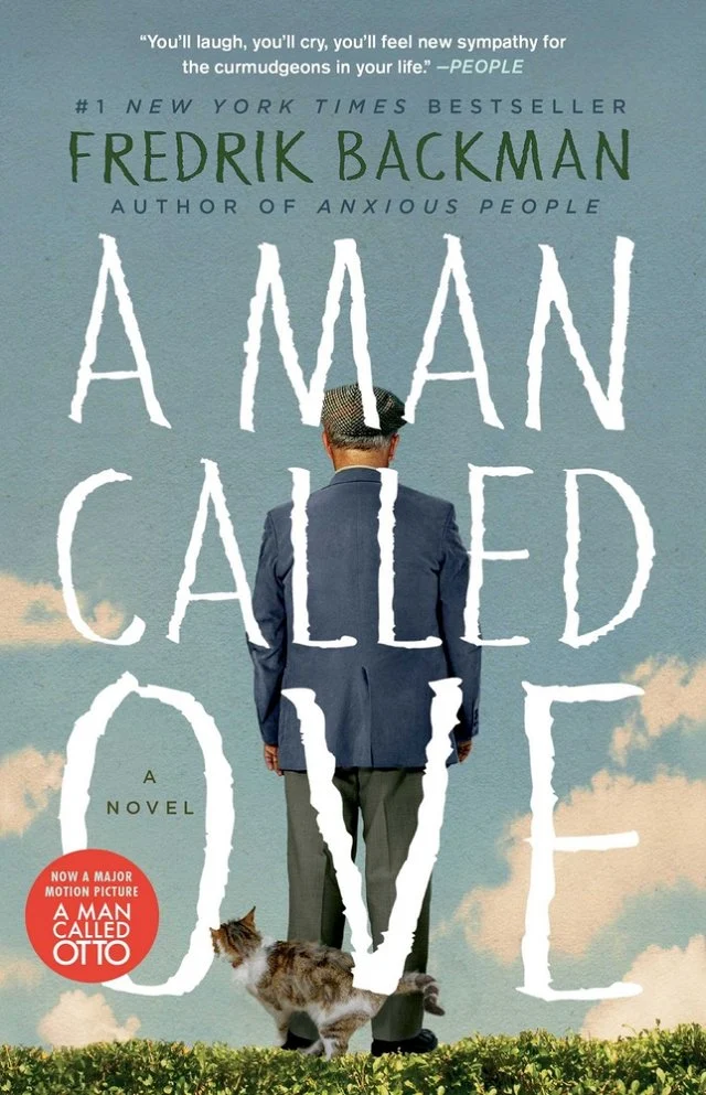 A Man Called Ove book cover of the back profile of a man standing in the grass looking at the sky with a cat circling his legs.