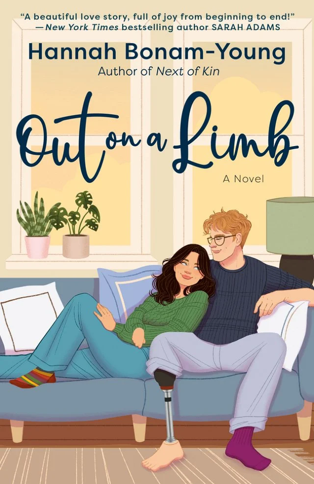 Out on a Limb cover featuring a cartoon depiction of a couple sitting on a blue couch in front of two windows. The male presenting character has a prosthetic leg and glasses, and he is looking down at the female.