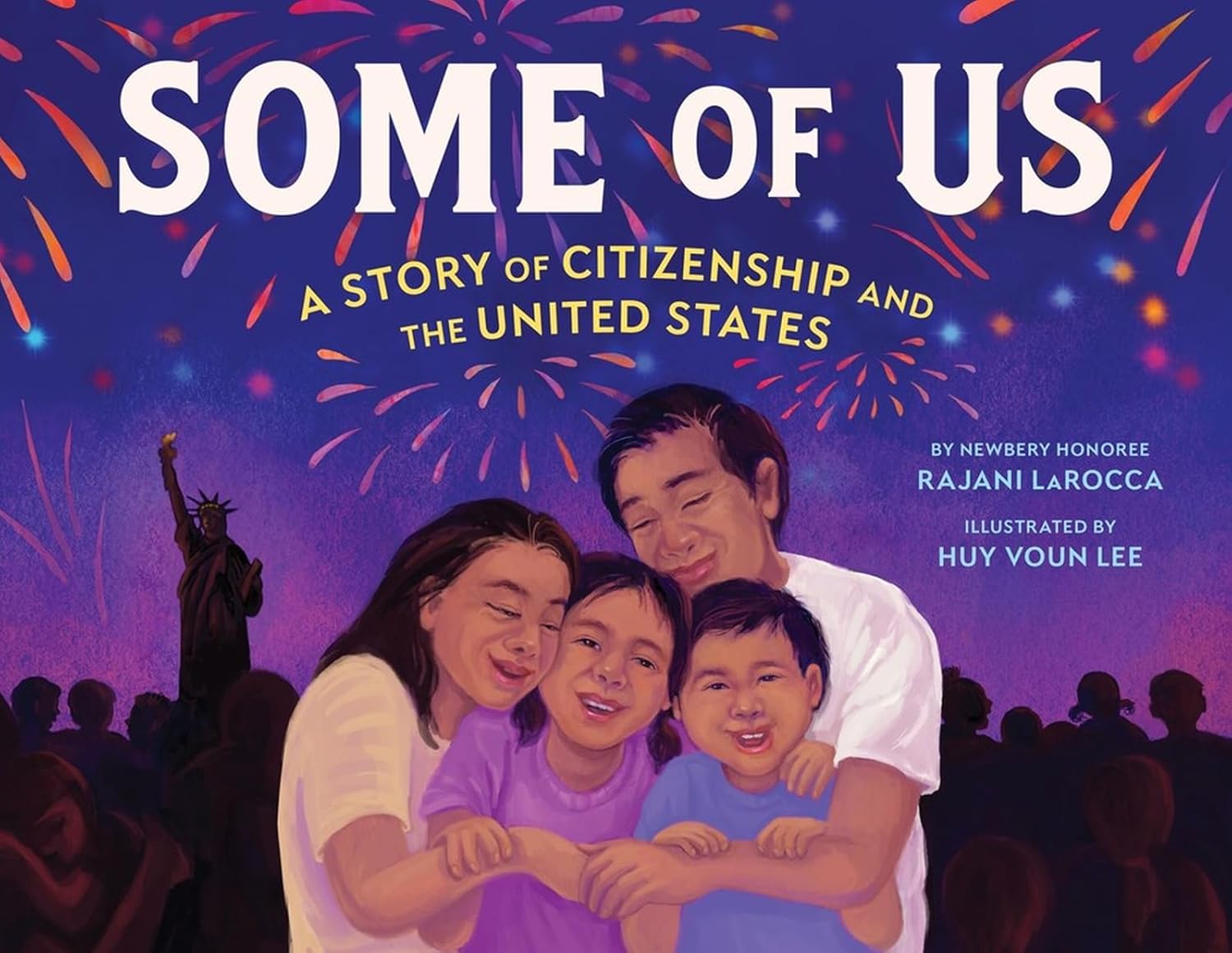 Book cover of Some of Us by Rajani LaRocca, Illustrated by Huy Voun Lee, featuring a family of brown-skinned, dark-haired people - two adults, two children - embracing one another under fireworks in the dusk sky; the silhouette of the Statue of Liberty can be seen in the background.