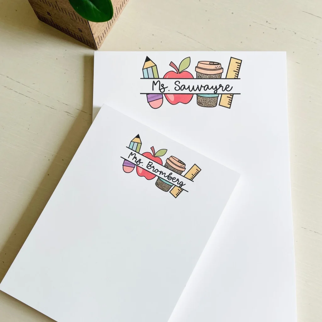 Two blank white notepads with a pencil, an apple, a coffee to-go cup, and a ruler at the top. In the middle of all the objects is the name of a teacher.