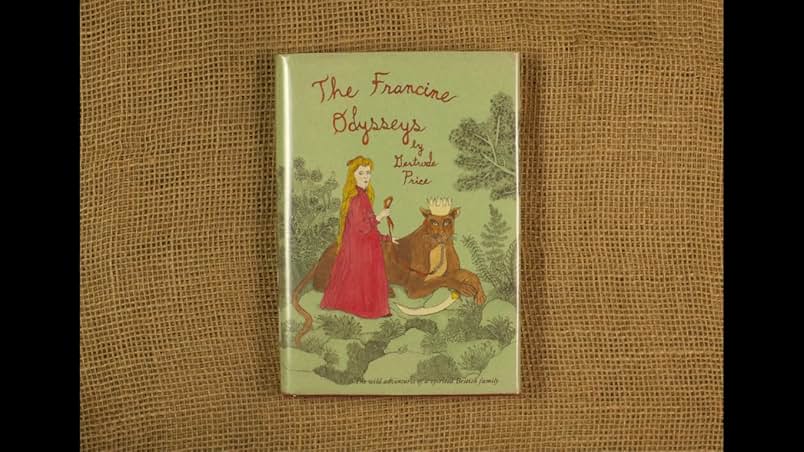 A brown burlap background. On top is a a copy of the book The Francine Odysseys. A green background with plants. A lion wearing a crown lies on the ground with its paw resting on a curved sword. Beside the lion is a girl in a red dress holding a red ribbon.