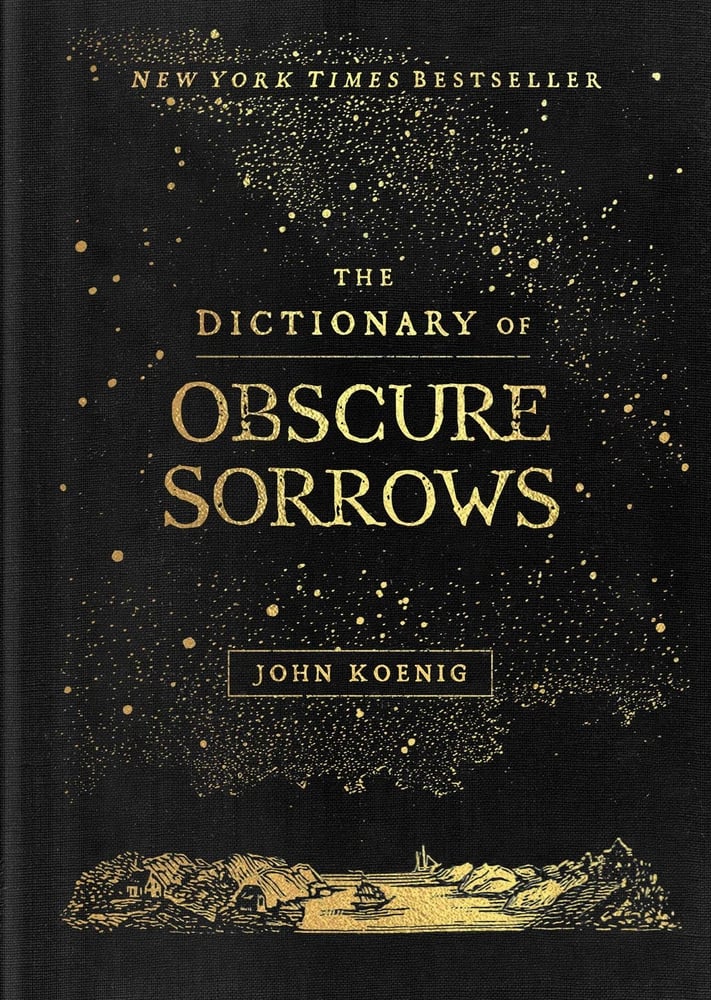 The book cover for The Dictionary of Obscure Sorrows. A black background with gold constellations and a gold landscape of a ship floating in a the water between rocks. The Dictionary of Obscure Sorrows is in gold lettering.