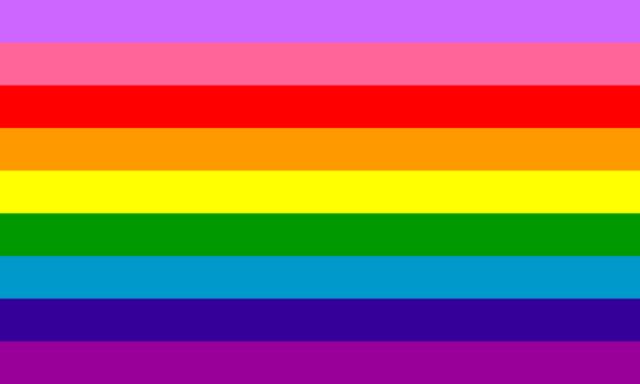 Gilbert Baker's 2017 pride flag design, consisting of nine horizontal stripes, from top to bottom: lavender, light pink, red, orange, yellow, green, light blue, dark blue, and purple.