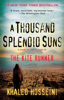 A Thousand Splendid Suns by Khaled Hosseini book cover, depicting someone in a burqa looking out at a sandy urban landscape.