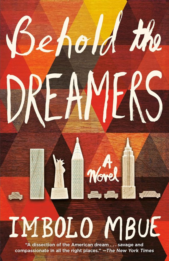 Behold the Dreamers by Imbolo Mbue book cover. Triangular design in shades of red with white wooden figures of cars and landmarks in New York City.