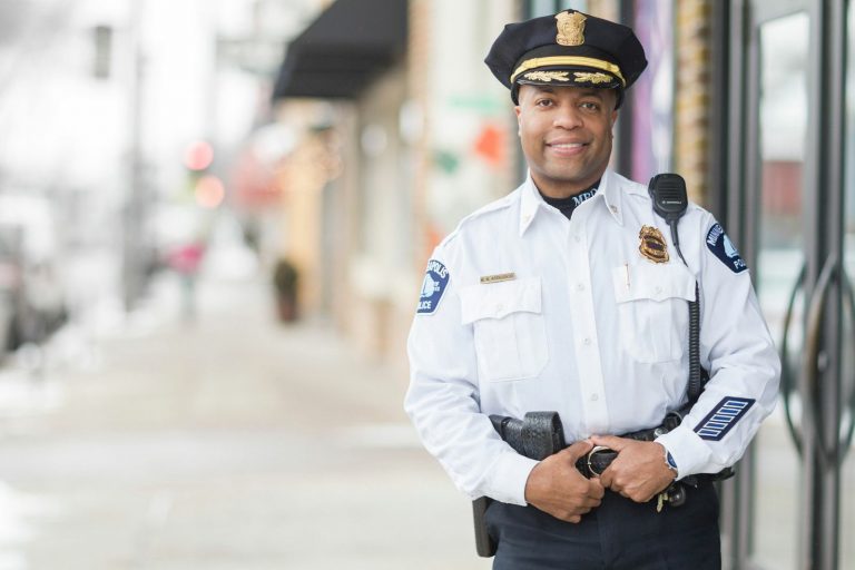 Police officer Arradondo in his uniform outside a business.