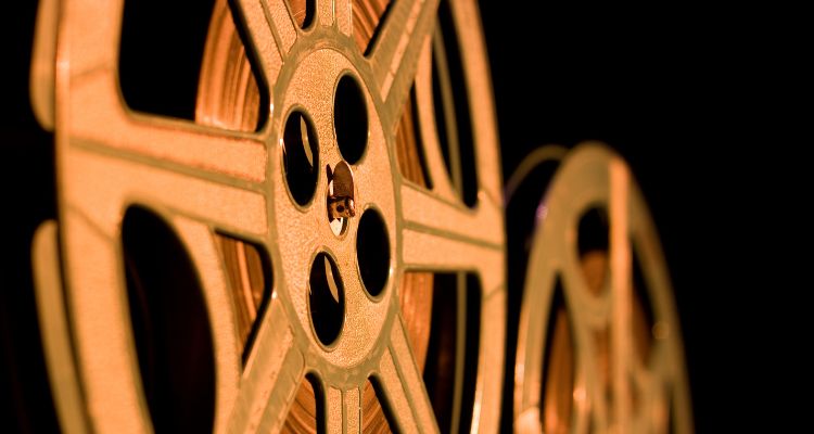A close up of two old movie film reels.