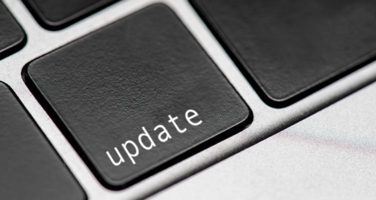 A computer keyboard zoomed into a single key with the word update on it.
