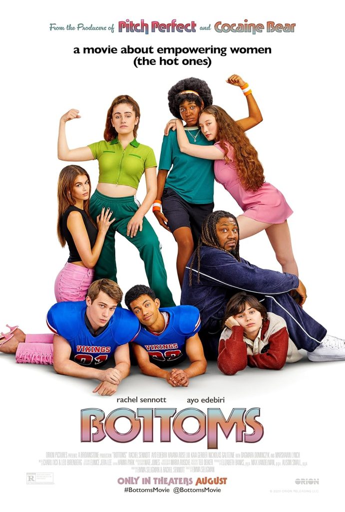 Bottoms movie poster by Metro-Goldwyn-Mayer depicting 8 different characters posing on a plain white background. From left to right: there is a brunette girl wearing a black shirt, pink trousers, and pink heels kneeling down and holding the leg of another girl, who is wearing a green polo ccrop top and darker green tracksuit bottoms with her auburn hair in a ponytail. On the floor between them, two men in American football uniforms lie in on their stomachs pouting at the camera. Next to them is another person in a white and red jacket, laying beneath the legs of an older, black man with dreadlocks in a matching navy tracksuit. Stood behind him is a black girl with afro curls and a plaid headband, turquoise t-shirt and blue shorts showing her arm muscles. Another girl in a pink sports dress with long curly hair is hugging her.