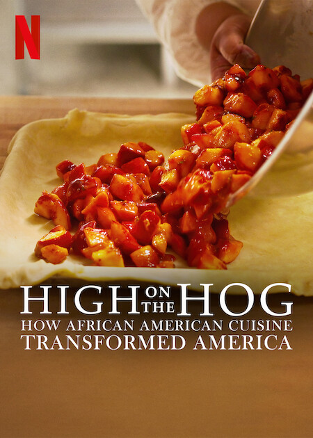 Poster for the docuseries High on the Hog: How American Cuisine Transformed America. Depicted are the hands of a Black person tipping peach filling from a metal bowl into a pastry-lined dish on a wooden counter.