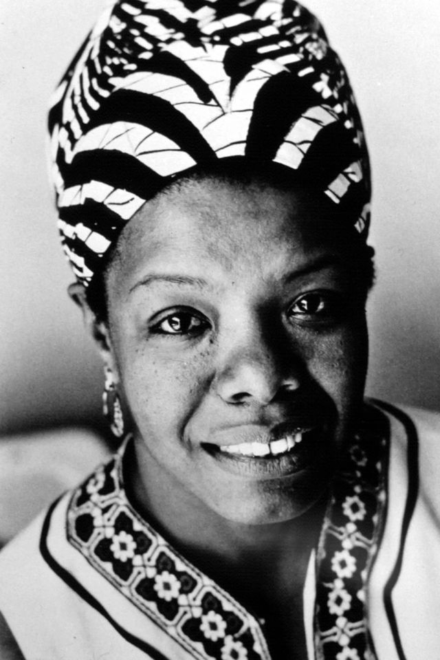 Maya Angelou, a Black woman in a headscarf, smiles at the viewer in black and white.