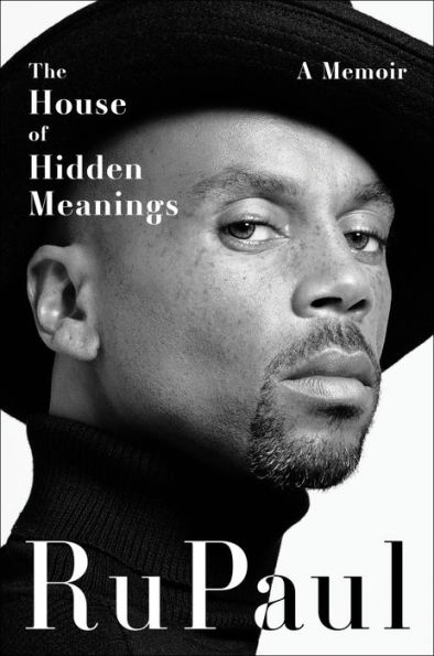 Black and white book cover featuring a close-up of RuPaul with a serious expression. They wear a hat and turtleneck. Text: "The House of Hidden Meanings: A Memoir, RuPaul."