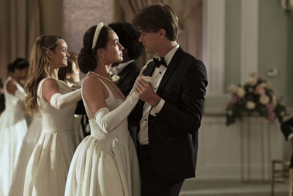 Belly (left) and Conrad (right) stand facing each other doing a slow dance
