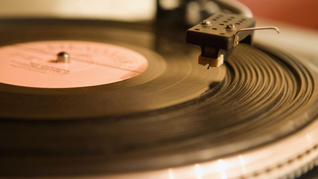 An up-close shot of a record on a record player.