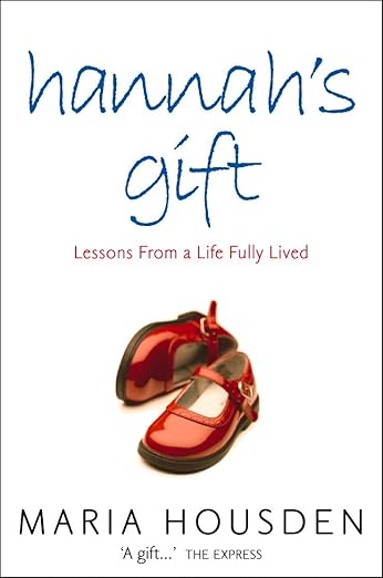 Hannah's Gift by Maria Housden book cover, depicting a red pair of children's shoes on a white background. The title is in a blue, lowercase, and hand-written font at the top of the cover.