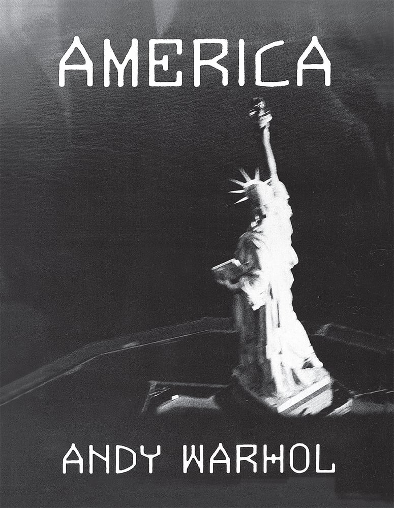 America by Andy Warhol book cover of a blurry black and white image of the top of the statue of liberty.